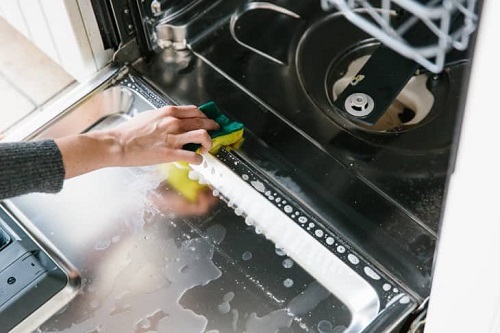 Wipe out the inside of the dishwasher